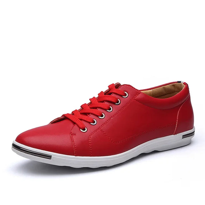 Red low-top comfort sneakers with memory foam insoles and sleek leather upper for all-day style and ease.