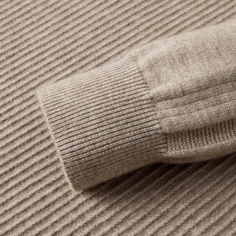 Close-up of the Windsor Quarter-Zip knitted sweater sleeve featuring premium fabric and textured pattern.
