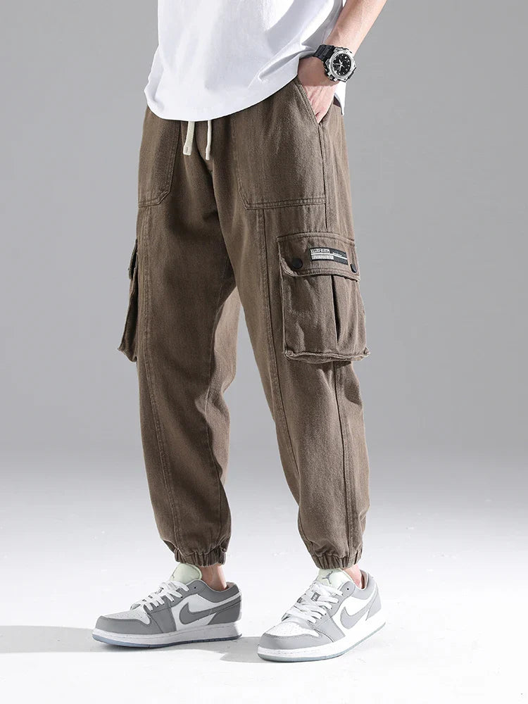 Lennox Cargo Joggers in brown, featuring oversized pockets, elastic cuffs, and a relaxed tapered fit, perfect for everyday wear.