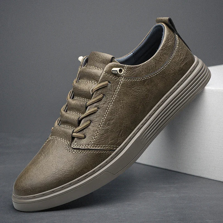 Ashton Genuine Leather Sneakers in olive green with precision stitching and cloud-like cushioning for ultimate comfort.