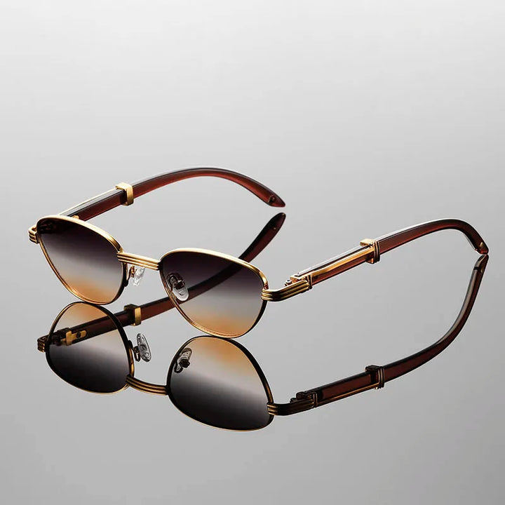 Orion Veil sunglasses with sleek gold-tone frames and gradient photochromic lenses, reflecting modern elegance.