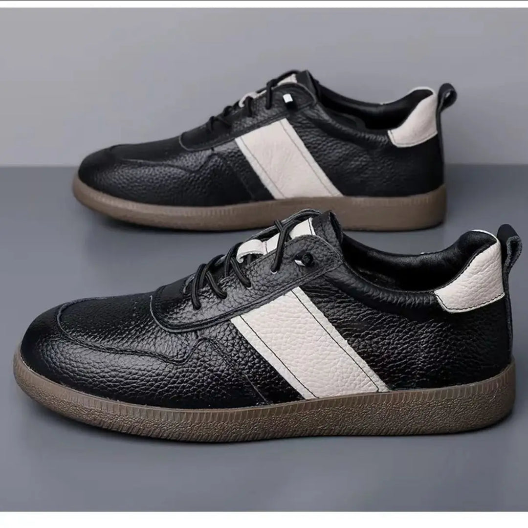 Axel Street Comfort Sneakers in black leather with contrasting side panel design and cushioned sole for all-day wear.