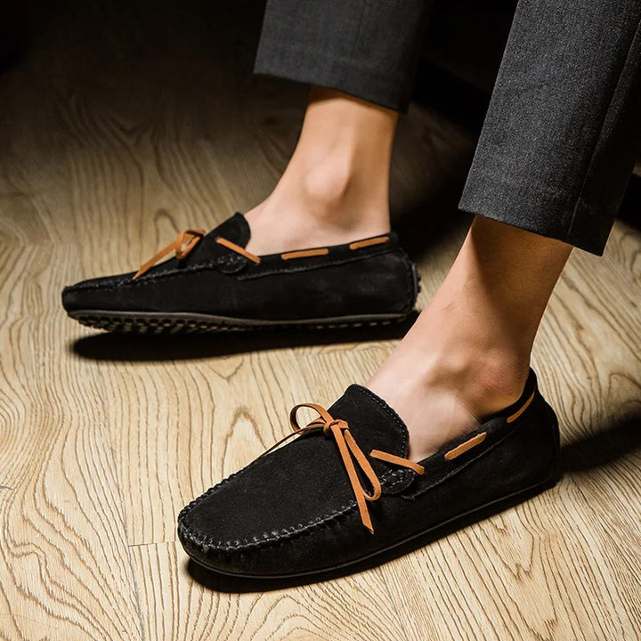 Monte Carlo genuine suede loafers featuring hand-stitched craftsmanship and premium leather laces in a stylish slip-on design.