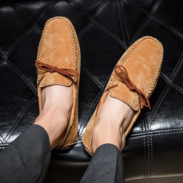 Monte Carlo genuine suede loafers with hand-stitched details and leather laces, perfect for comfort and style.