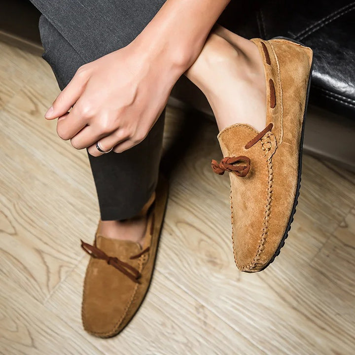 Monte Carlo genuine cowhide suede loafers with hand-stitched details and premium leather laces, featuring slip-on design.