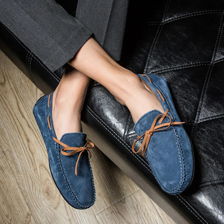 Monte Carlo genuine suede loafers in blue with hand-stitched details, premium leather laces on a stylish background.