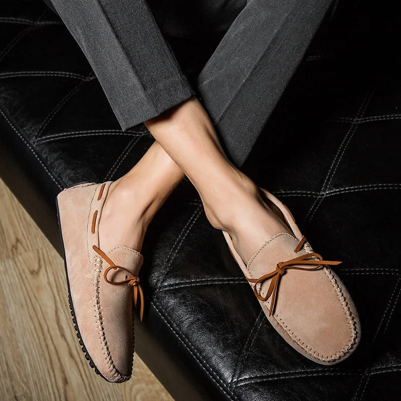 Monte Carlo Genuine Suede Loafers on a man’s feet, showcasing hand-stitched details and premium leather laces.