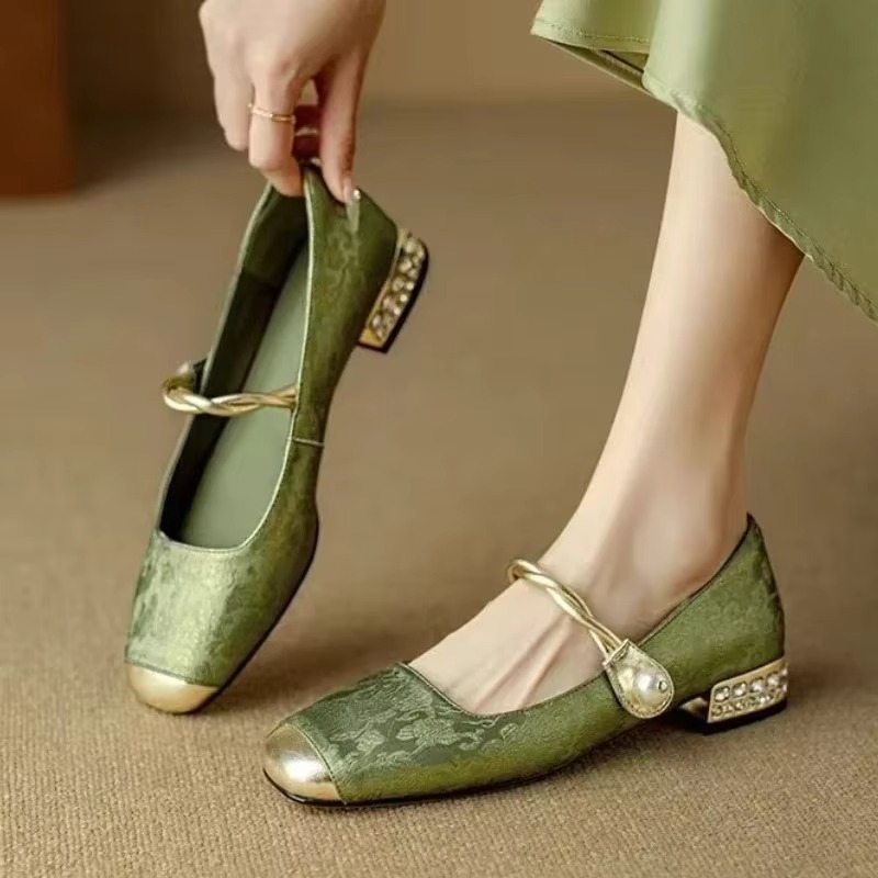 Cordelia Vintage Pump Heels in green with twisted strap and sculptural block heel, offering retro charm and comfort.