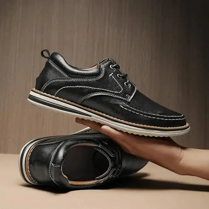 Luciano Genuine Leather Oxfords in black with contrast moc toe stitching, showcasing a sleek lace-up design.