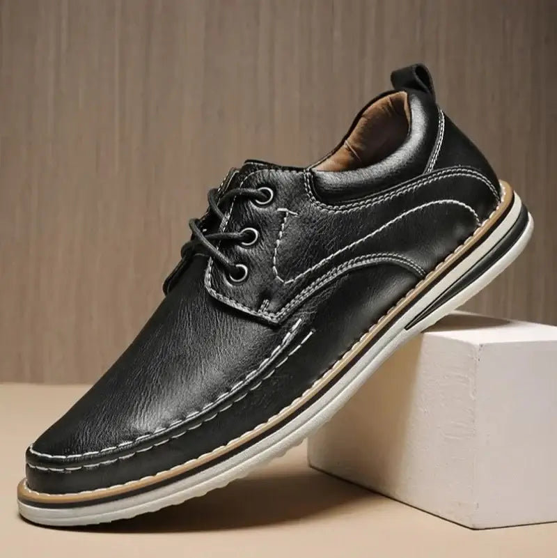 Luciano Genuine Leather Oxfords in black, featuring contrast moc toe stitching and a cushioned collar for comfort.