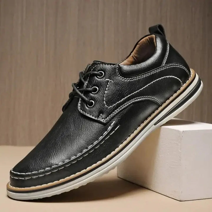 Luciano Genuine Leather Oxfords in black, featuring contrast moc toe stitching and a cushioned collar for comfort.
