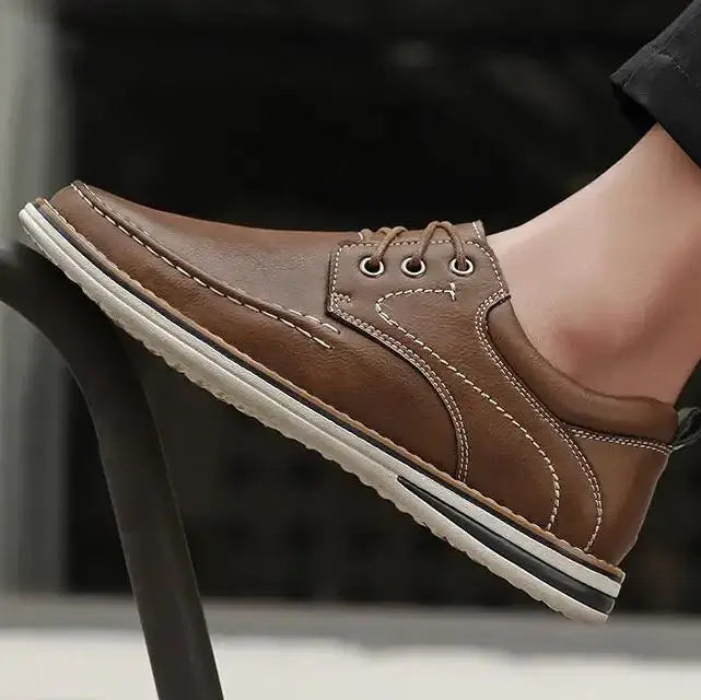 Luciano Genuine Leather Oxfords showcasing full-grain leather, contrast stitching, and a cushioned collar for comfort.