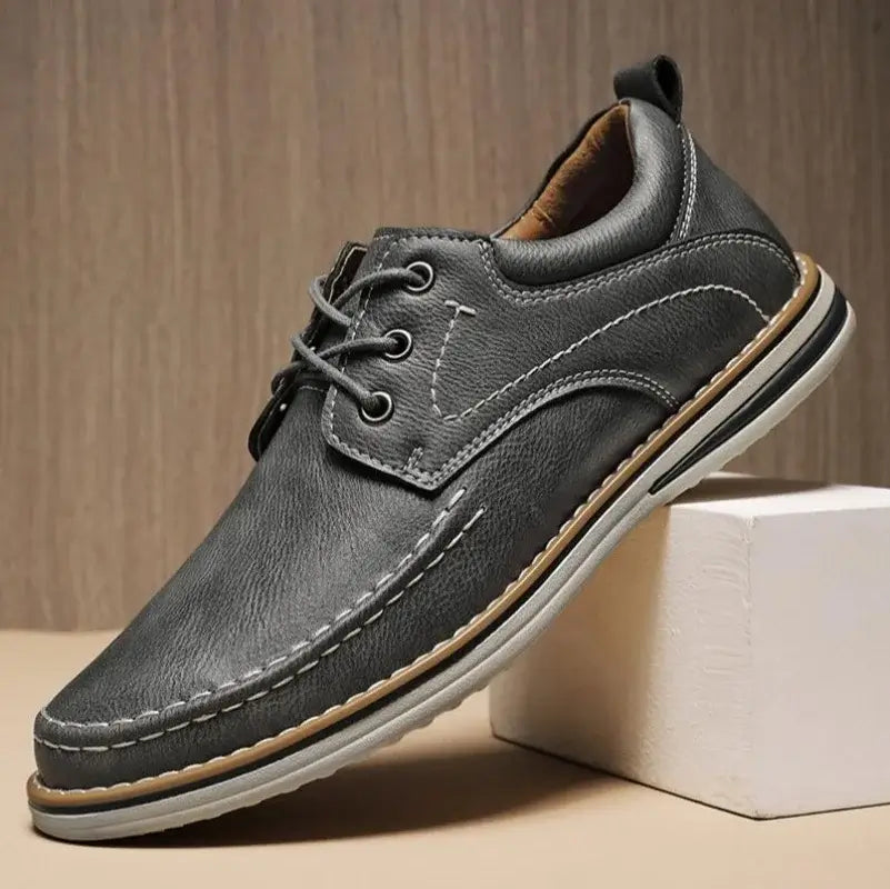 Luciano Genuine Leather Oxfords in gray with contrast moc toe stitching and cushioned collar for comfort.