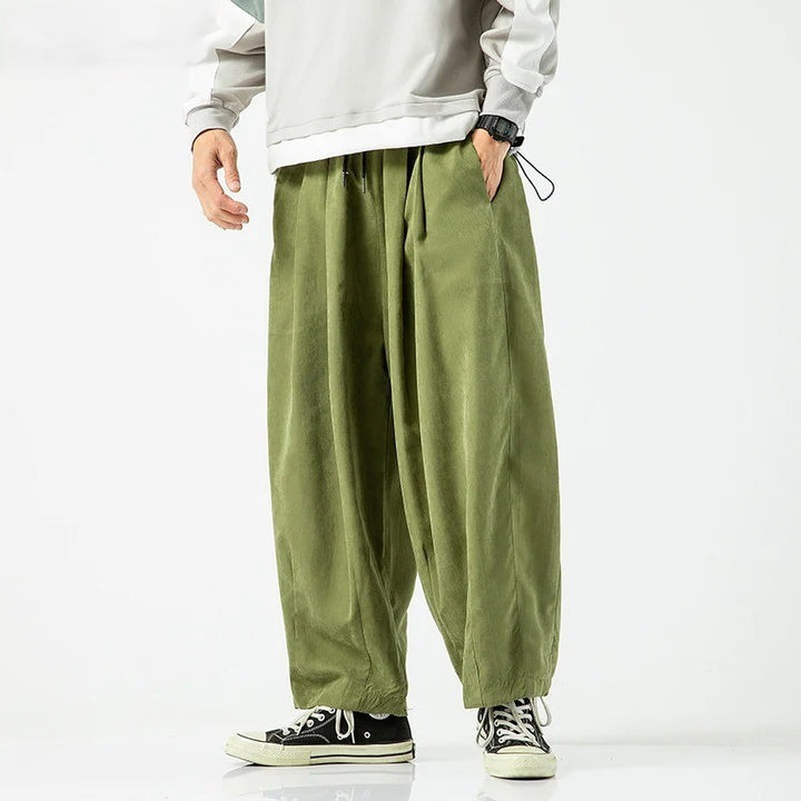Cove Park Relaxed Pants in olive green with a wide-leg silhouette and deep side pockets, perfect for stylish comfort.