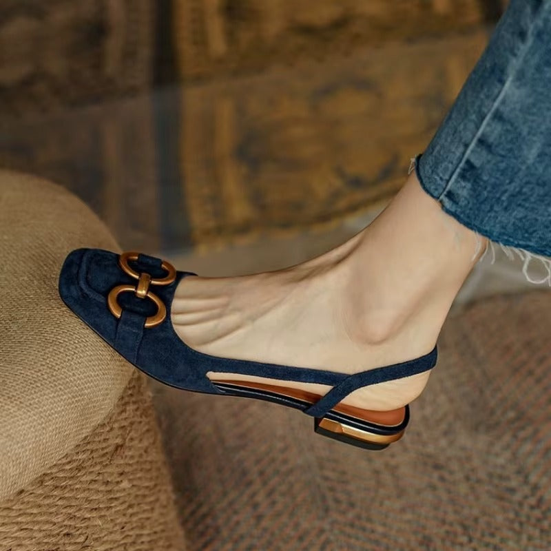 Rivena Slingback Sandals featuring structured square toe, cushioned footbed, and bold metal bit accent.
