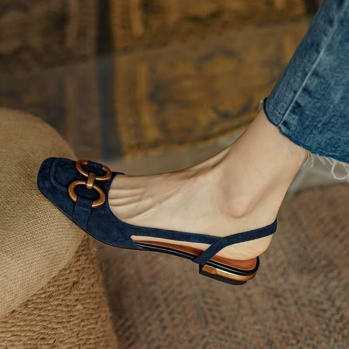 Rivena Slingback Sandals featuring structured square toe, cushioned footbed, and bold metal bit accent.