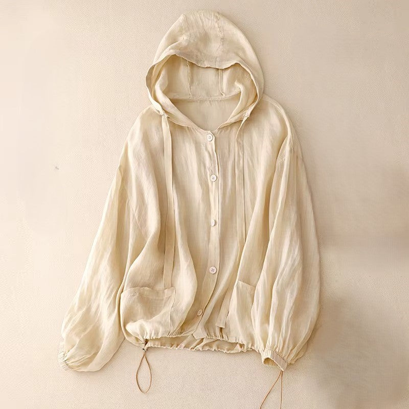Calypso Coast Linen Hoodie in soft beige, featuring a hood, button-up front, and adjustable drawstring hem for comfort.