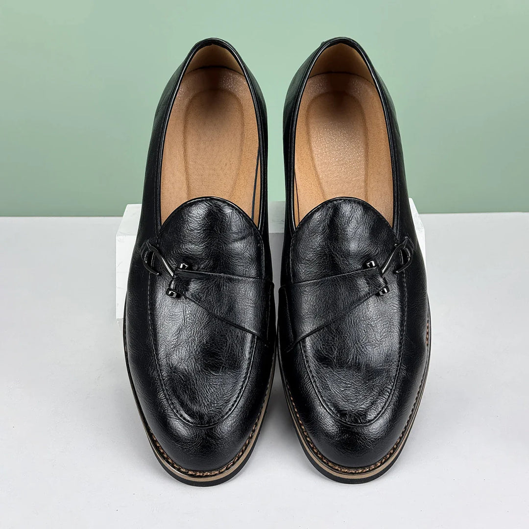 Renley Men's Genuine Leather Loafers in black with burnished toe and metal bit accent, featuring cushioned insole and rubber sole.