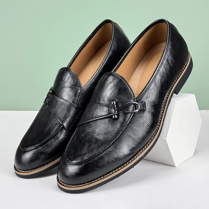 Renley Men's Genuine Leather Loafers in black with burnished toe and metal bit detail, featuring cushioned insole and rubber sole.