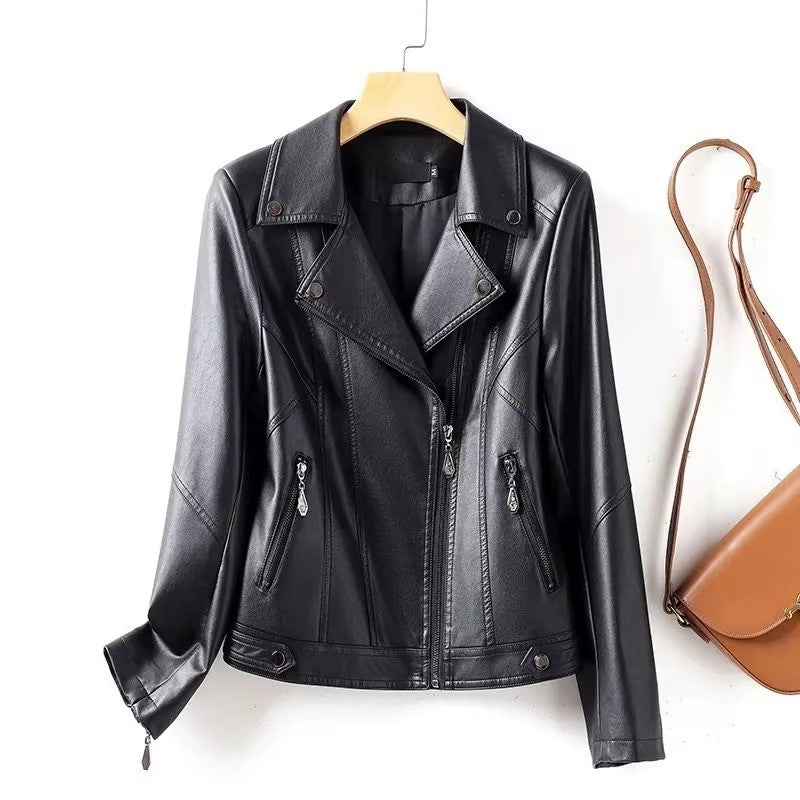 Black leather jacket on a hanger with a brown handbag on a white background
